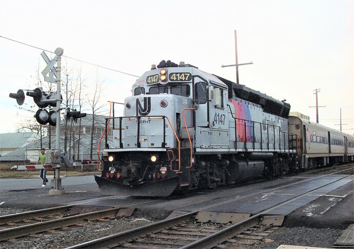 NJT GP-40PH-2  #4147 crossing 16th Ave in Belmar, NJ. Southbound in March 2012. (#4147-PC & CR GP40 #3174, blt 10-68)
