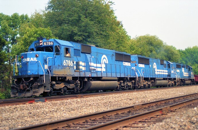 Conrail. SD-50 # 6786, #6799 and GP40-2 #3356 west at Cove, PA. August 1991