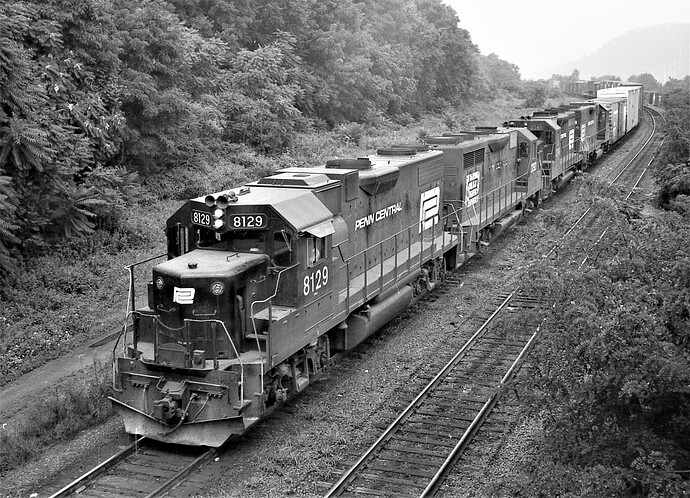 Penn Central GP-40 #8129  and 3 other units heading into Enola, PA. August 1975
