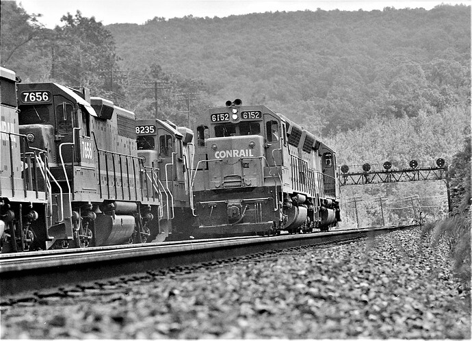 Conrail. Action at Bennington interlocking near Tunnel Hill, PA. SD45 #6152 & other SD45.  July 1977