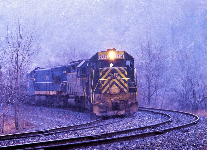 D&H. GP39-2 #7414 GP39-2 #7616 & U23B #2314 on freight across from Jim Thorpe, PA in March snow 1980