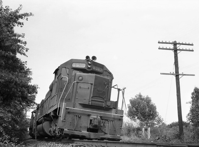 CNJ. SD-40 #3067 eastbound at M.P. 38. Raritan, NJ August 1972
