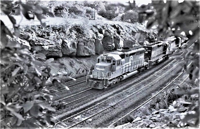 Conrail. Bennington Curve near Tunnel Hill, PA. SD40-2 #6284, #6355 & another unit.  July 16, 1976