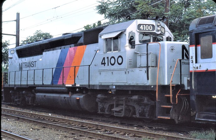 NJT. GP-40P #4100 running long nose forward at South Amboy, NJ. 1982
