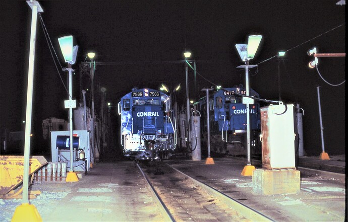 Conrail fueling rack in Enola, PA. Diesels GP-10 #7566 & SD40-2 #6470 being fueled on May 5, 1986