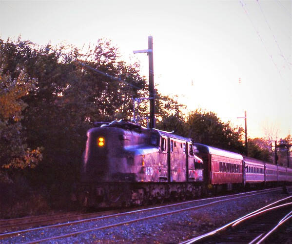 NJT. GG-1 #4879 with the final GG-1 run approaching South Amboy, NJ with NYC train. Shore Commuter Club car behind the GG-1. Nov 1983