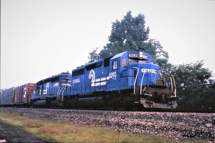 CR. SD40 #6293 (ex PRR & PC) & SD40-2 #6461 east at Cove, PA. Sept 1983