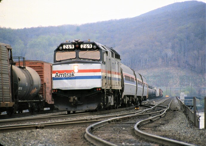 Amtrak. F-40PH #269 with eastbound Pennsylvanian on Rockville Bridge. 3-12-84
