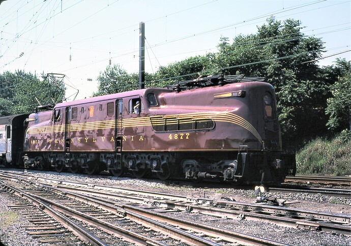 NJT. GG-1 #4877 heading east to NYC from South Amboy, NJ. July 1981