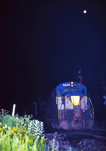 Delaware & Hudon GE U33-C # 755 helpers head south near Belden Tunnel, Belden, NY. 1984