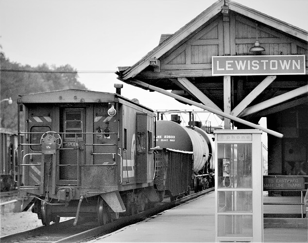Conrail. Westbound freight at Lewistown, PA. 211 series caboose trailing. August 1977