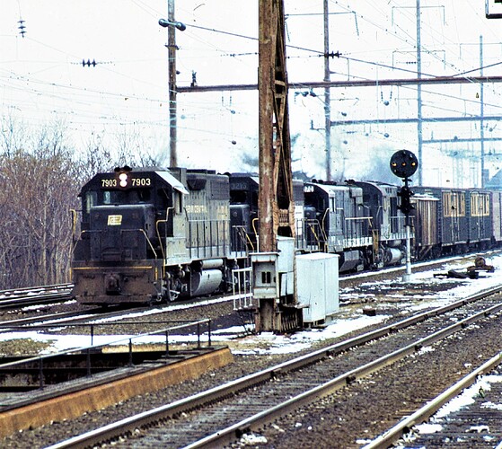 PC. GP38 #7903, GP-40 #3213, U-25B #2870, Alco C-430 #2421. EB freight at Rahway, NJ. Jan 19, 1976