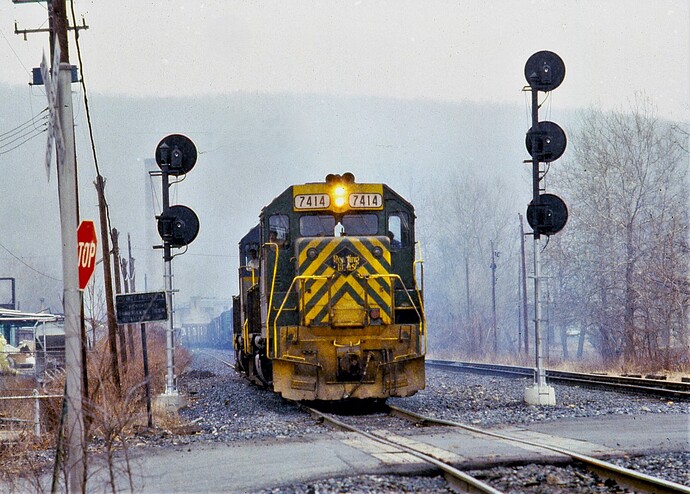 D&H freight crossing over on track. GP38-2 #7414, GP-40 #7616 & U23B #2314. S. Albert St, Allentown, PA, March 1980