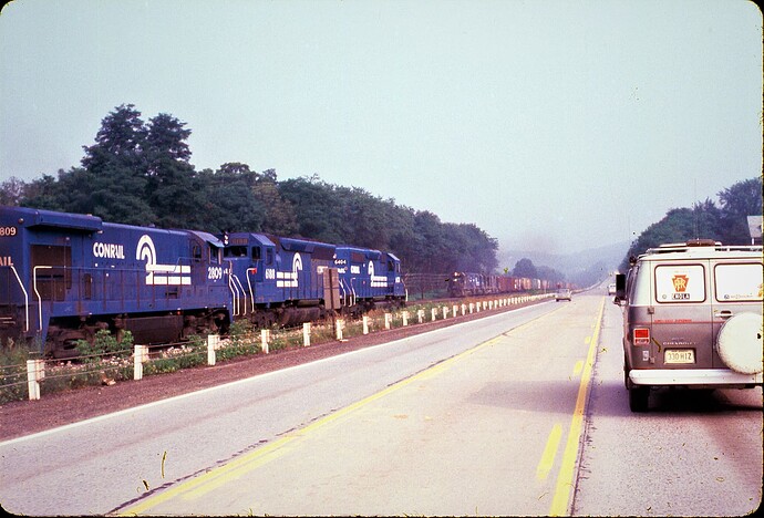CR. Pacing freights on Rt 322 on P&E. July 1978