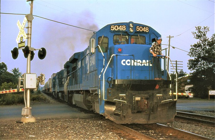 Conrail. B36-7  #5048 with TV train at South Plainfield, NJ. August 23, 1988.