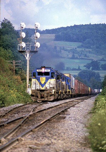 Delaware & Hudson GP39-2 #7411 (ex RDG #3411) C-420 #412 & other Alco on freight leaving siding at Nivenah, NY in August 1984