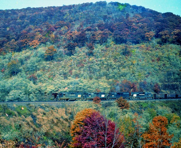 PC. GP35 #2384, #2354, GP40 #3058 & #3067 handle a west ore train on Horseshoe Curve, 10-74