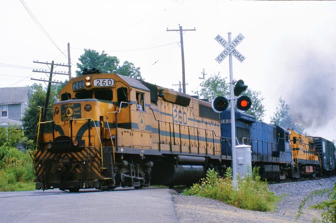 D&H. Maine Central GP-38 #260, U23B #190 & MEC U25B #231 on freight. Depot St, Sanitaria Springs, NY1984