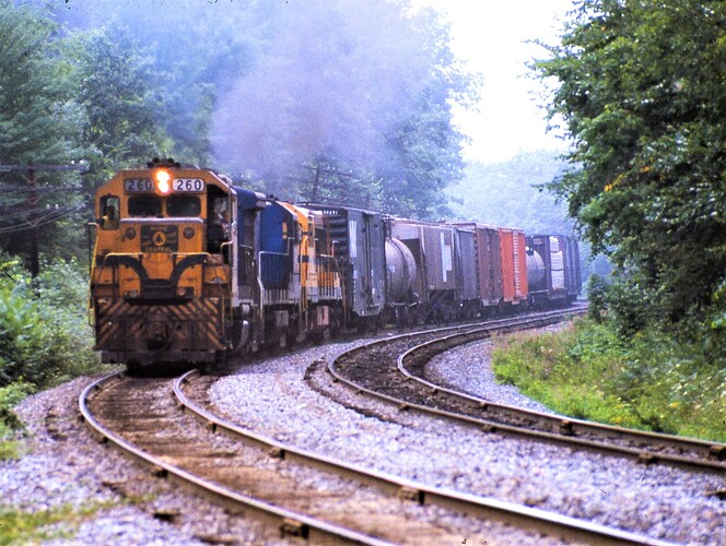 D&H. Ex-MEC GP38 #260 with north freight heading to Belden, NY. Aug 1984