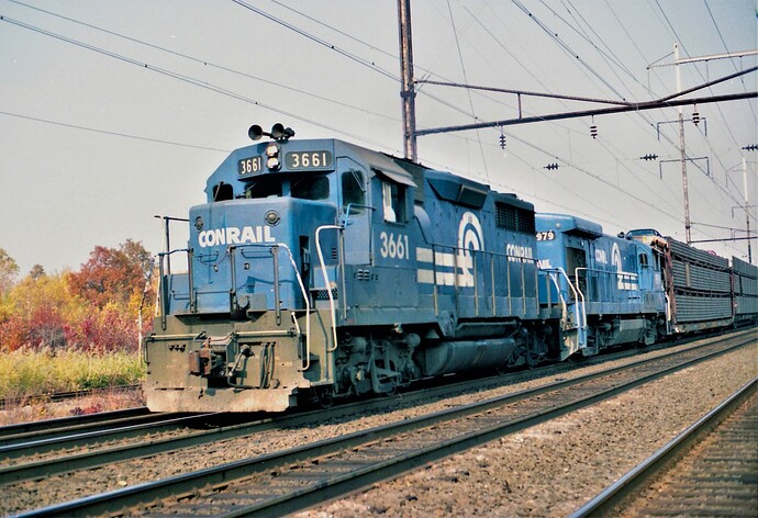Conrail GP #3661 & GE B23-7 #1979 westbound freight at Adams Station, NJ. April 1988