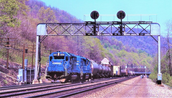Conrail. SD40-2 #6461 & #6469 are westbound at the MG Tower signal bridge on May 5, 1986.