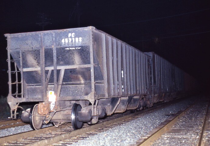 Penn Central hopper #457162 with FRED. Eastbound at New Market Road, Piscataway, NJ. May 14, 1983