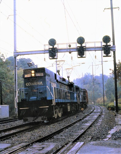 Conrail. E-44 #4427 & friend on eastbound freight at West Fairview, PA on rainy Sept 15, 1979