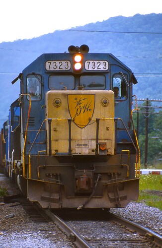 D&H GP38-2 #7323 leads the coal train out of Binghamton, NY. 8-84