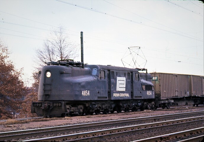 PC. GG-1 #4854 with west Flexi-Van train. No. Rahway, NJ. Oct 1975