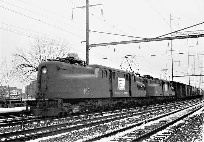 Penn Central GG-1 #4824 & #4815 on eastbound freight in winter at New Bruns, NJ. January 27, 1975