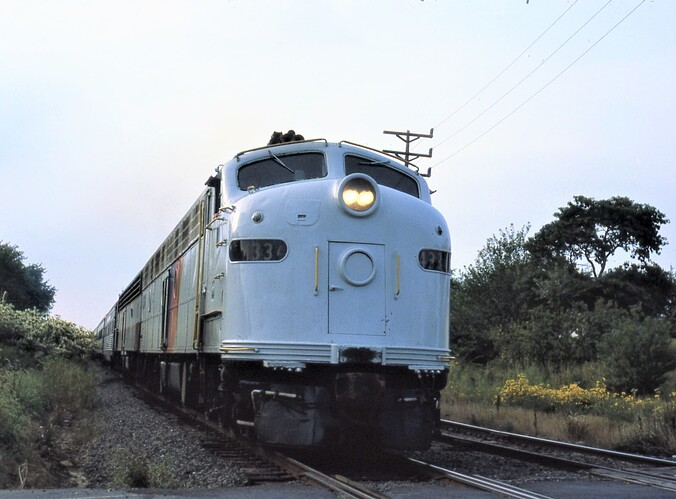 NJT. E-8 #4334 at Cliffwood Beach crossing. westbound in Sept 1982