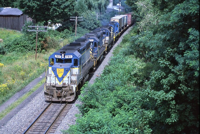 D&H GP39-2 #7411, GP38-2 # 7321. Alco C-420 #412 & C424m #451 on the freight north of Binghamton, NY. Aug 1984
