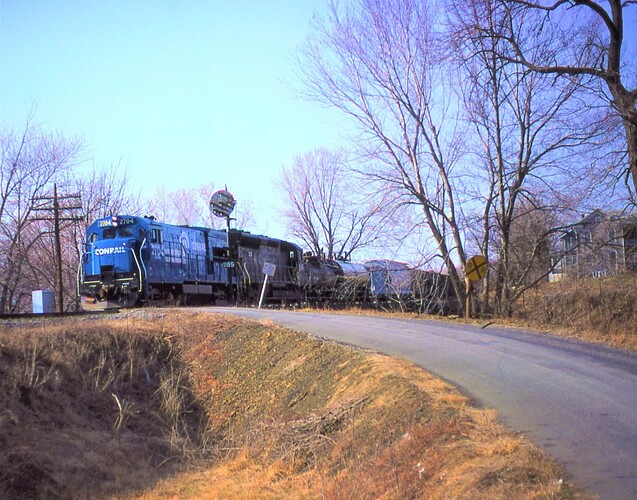 Conrail. GE U-23B # 2704, SD-45 # 6154 southbound on Northern Central heading towards Rockville Bridge. March 1980