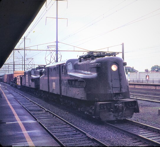 PC. GG-1 #4844 & friend are west on track 3 on Oct 14, 1972. The GG-1 still has it's PRR stripes. Rahway, NJ
