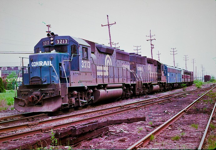 CR. GP40 #3213, #3276 picking up 3 E-8's on westbound freight in the South Plainfield, NJ yard.