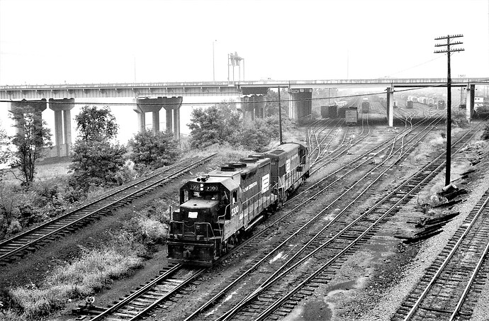 Penn Central. GP-35 #2300 & GE #2749 at West End Enola, PA yards. Rt 81 undercontruction and caboose track to left. 1973
