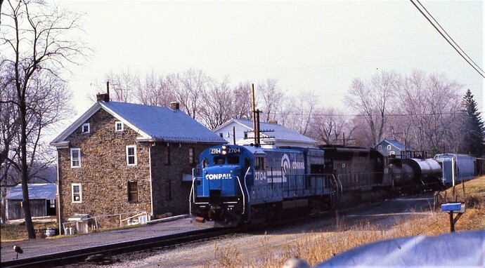 CR. GE-U23B #2704 & SD-45 #6154 eastbound on Northern Central. March 1980