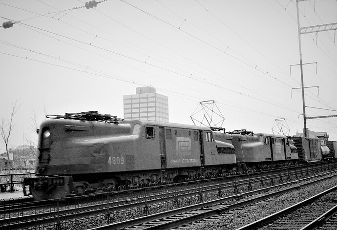Penn Central GG-1 #4809 & #4849 with eastbound freight at New Brunswick, NJ. March 1976.