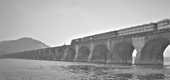 PC. Ex-PRR U25C #6503 (blt in 4-65) & ex-PRR SD45 #6158 (blt 1-67), East across Rockville Bridge in Sept 1975