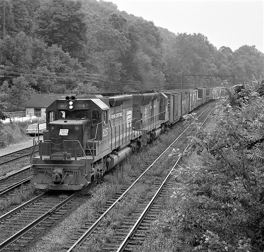 PC. SD-40 #6257 & SD45 east at Banks Tower, Aug 1975.