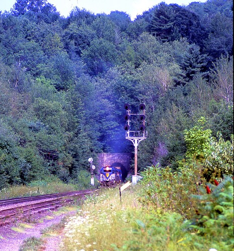 D&H GP38-2 #7411 leaving Belden Tunnel, Belden, NY. Aug 1984