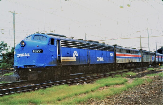 Conrail E-8 #4022 leading westbound Broadway Limited at Harrisburg, PA station in Aug 1977