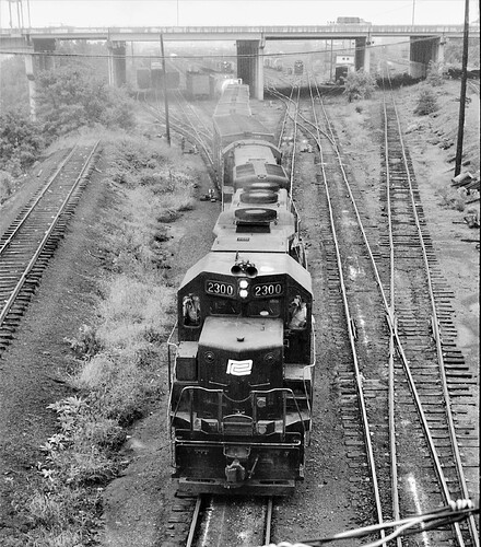 Penn Central. GP-35 #2300 & U23B #2749 with GE leaving Enola, PA. Sept 1973