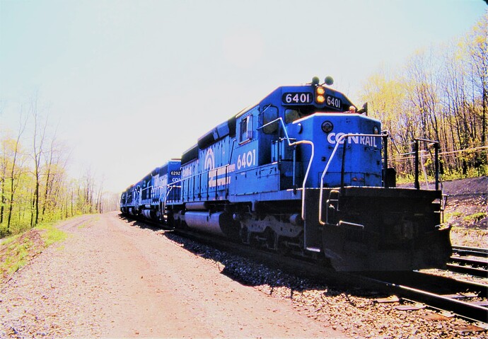 Conrail. SD40-2's # 6401, #6292 eastbound at MG Tower. May 5, 1986