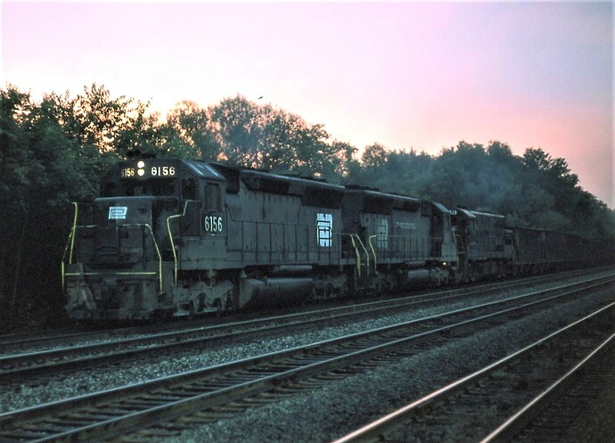 Sunrise at Cove, PA. SD-45 #6156 & others on awestbound freight in August 1975
