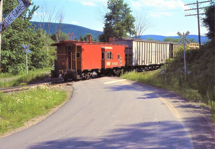 D&H. N&W Caboose #557525 (ex NKP #425) on D&H freight at New Delhi. NY. August 1977
