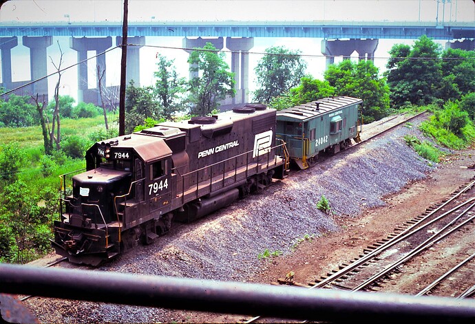 CR. ex-PC GP38-2 #7944 placing caboose #24042 on Enola, PA  'pimple track' July 15, 1976. #7944 was blt in May 1972