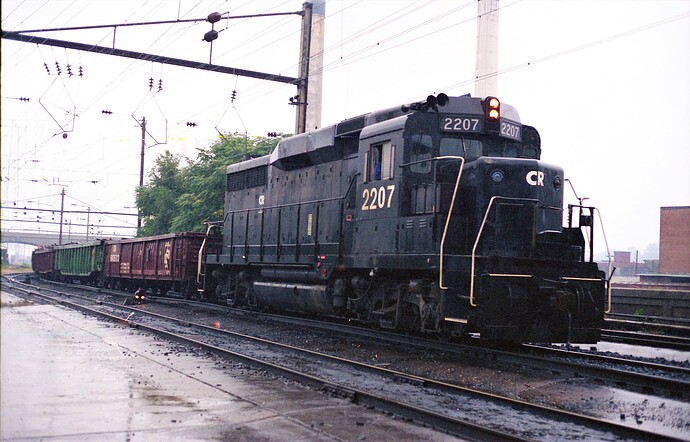CR. GP-30 # with gondolas at Harrisburg, PA station. Rainy day 9-15-79