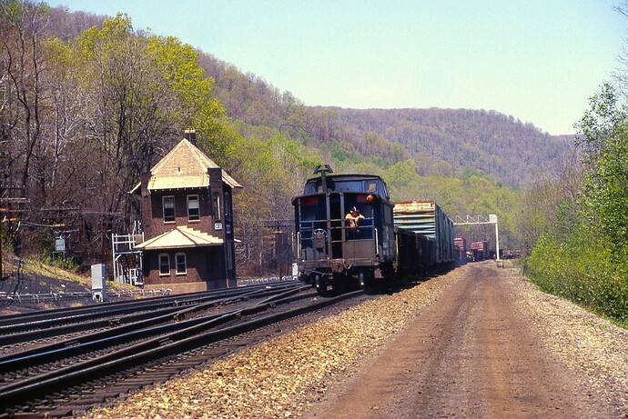Conrail. Eastbound freight at MG Tower. May 5, 1986