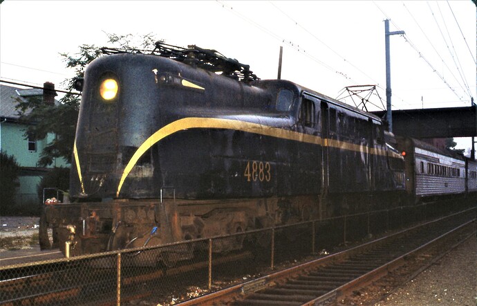 NJT. GG-1 #4883 arriving in the early evening at South Amboy, NJ. 1983